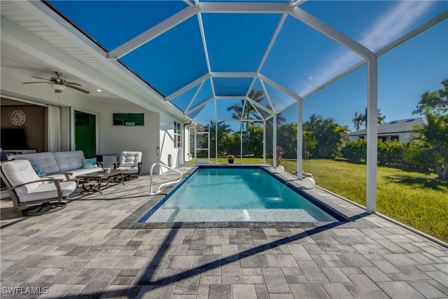 view of pool with a lawn, an outdoor hangout area, pool water feature, ceiling fan, and a patio area