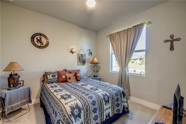 bedroom with ceiling fan and carpet