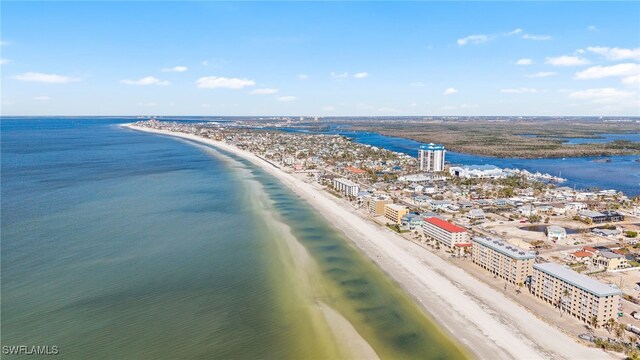 drone / aerial view featuring a view of the beach and a water view