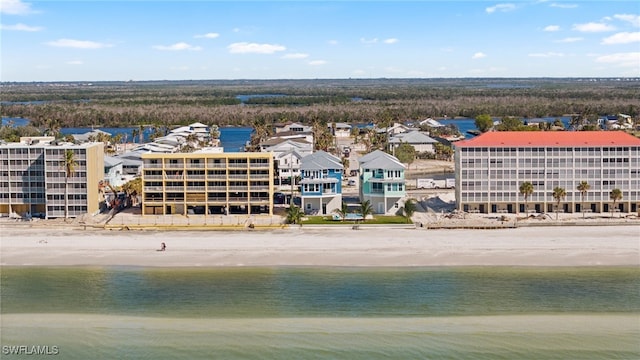 drone / aerial view featuring a view of the beach and a water view