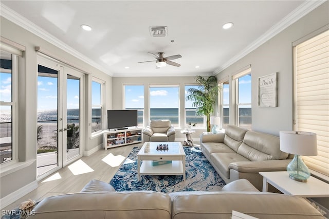 living room with french doors, light hardwood / wood-style floors, and plenty of natural light