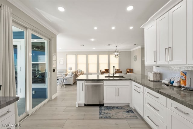 kitchen featuring dishwasher, sink, kitchen peninsula, crown molding, and white cabinets