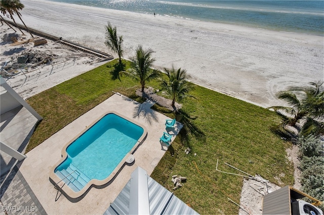 bird's eye view with a water view and a beach view