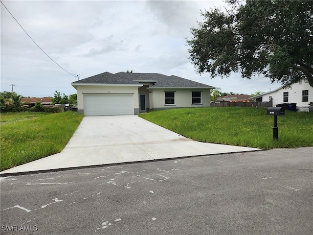 view of front facade with a garage and a front yard