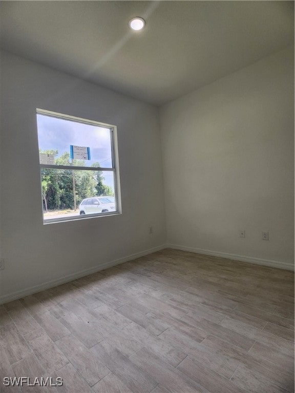 unfurnished room featuring light hardwood / wood-style floors