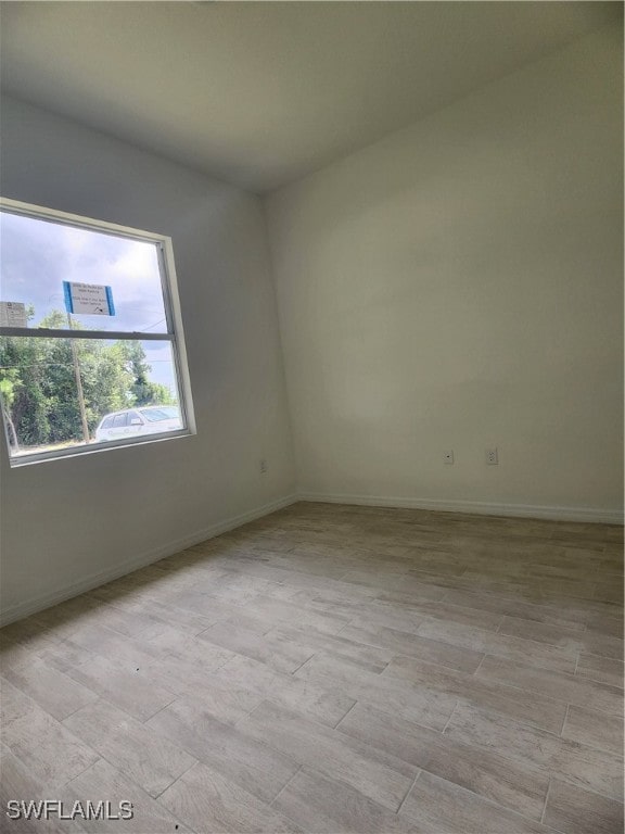 empty room with light hardwood / wood-style floors