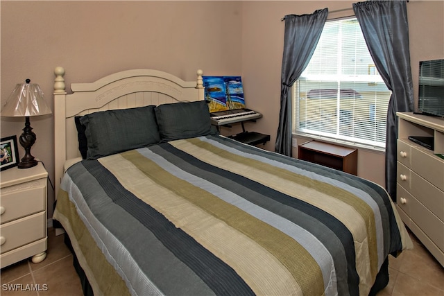 bedroom with tile patterned floors