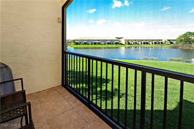 balcony featuring a water view