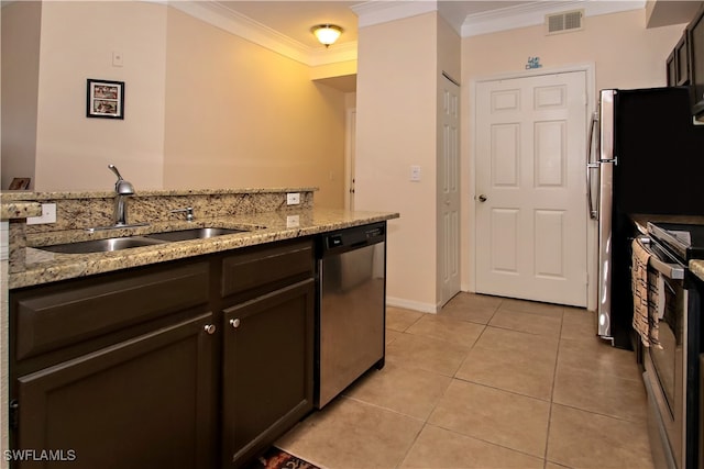 kitchen with light stone countertops, stainless steel appliances, crown molding, and sink