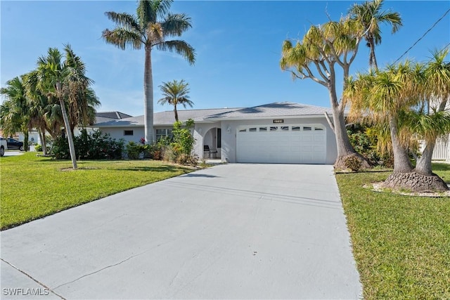 single story home featuring a front yard and a garage