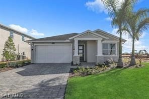 view of front facade featuring a front yard and a garage