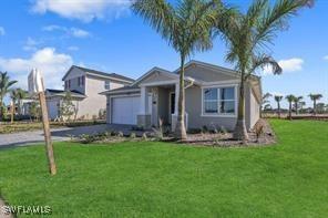 view of front of house featuring a front lawn and a garage