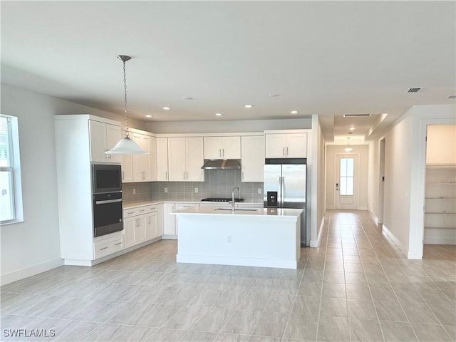 kitchen featuring stainless steel refrigerator with ice dispenser, backsplash, a sink, black oven, and under cabinet range hood