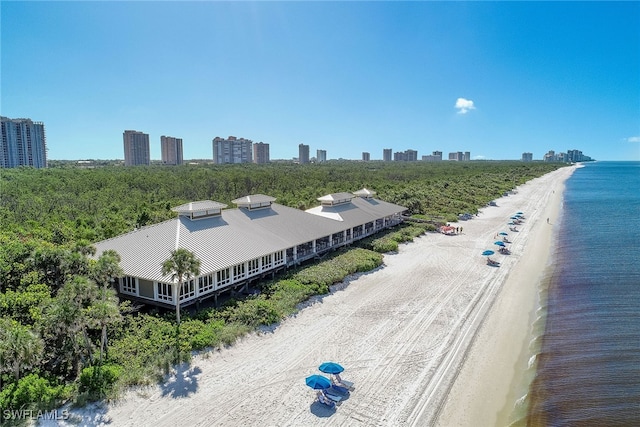 aerial view featuring a water view and a beach view