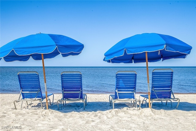 exterior space with a beach view and a water view