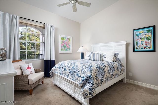 carpeted bedroom featuring vaulted ceiling and ceiling fan