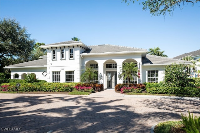 mediterranean / spanish home with a porch