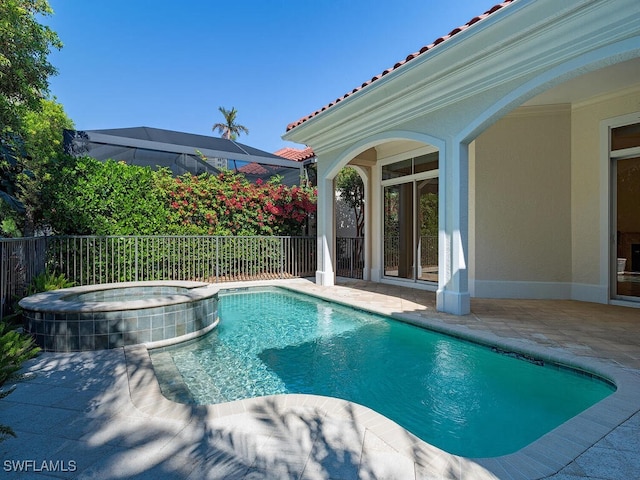 view of pool featuring an in ground hot tub and a patio