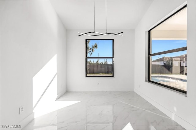 spare room featuring a wealth of natural light