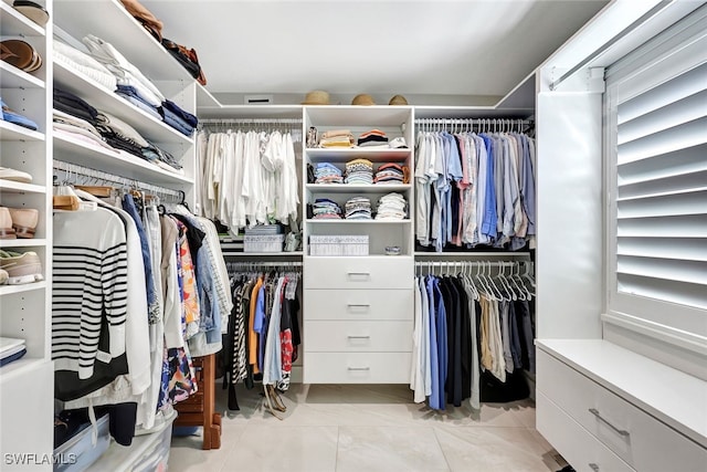 walk in closet featuring light tile patterned floors