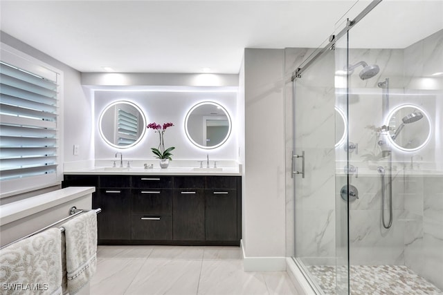 bathroom featuring vanity and a shower with door