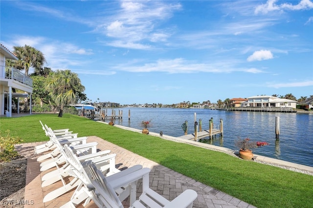 dock area featuring a yard and a water view