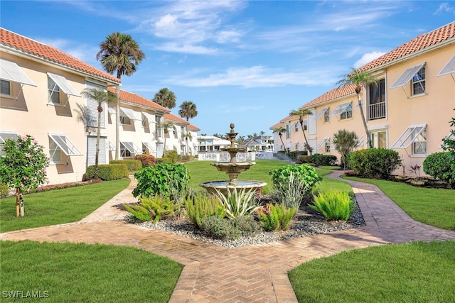 view of property's community featuring a yard