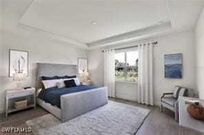 bedroom featuring a tray ceiling and dark hardwood / wood-style flooring