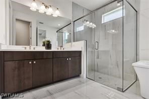 bathroom with vanity and walk in shower