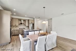 dining room featuring light wood-type flooring