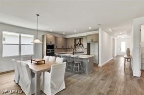 dining area with dark hardwood / wood-style flooring