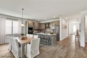 dining space featuring dark wood-type flooring