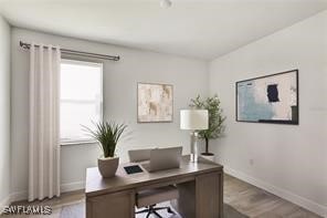 office space with light wood-type flooring