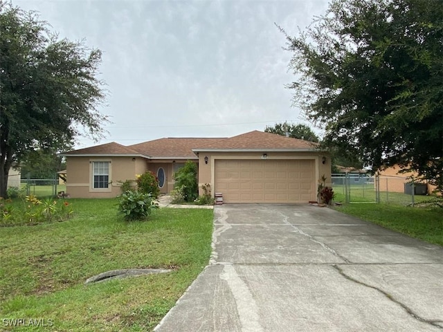 view of front facade featuring a front yard and a garage