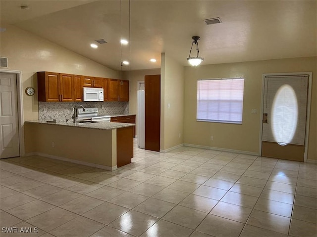 kitchen with kitchen peninsula, vaulted ceiling, light tile patterned floors, electric range, and hanging light fixtures