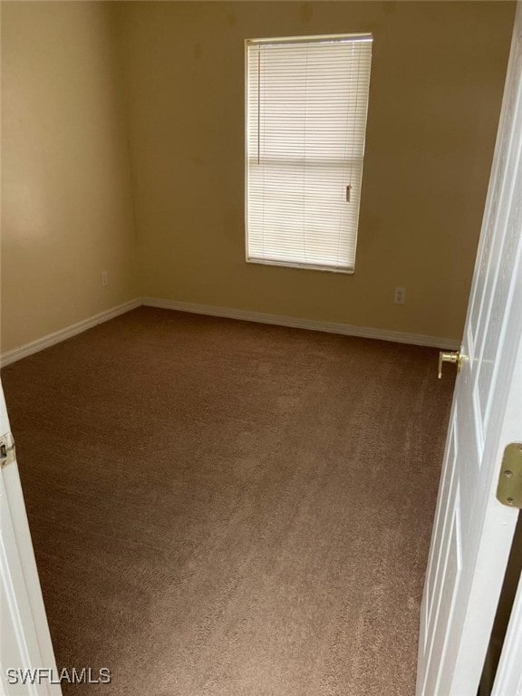 unfurnished room featuring carpet floors