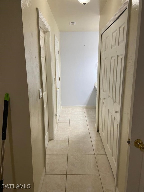 hallway with light tile patterned floors