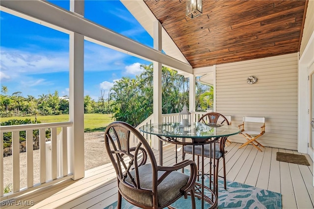 sunroom / solarium featuring wooden ceiling and lofted ceiling