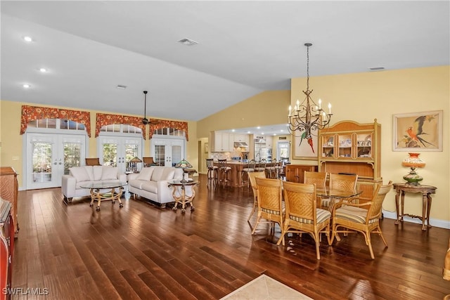 dining space with a chandelier, french doors, dark hardwood / wood-style flooring, and lofted ceiling