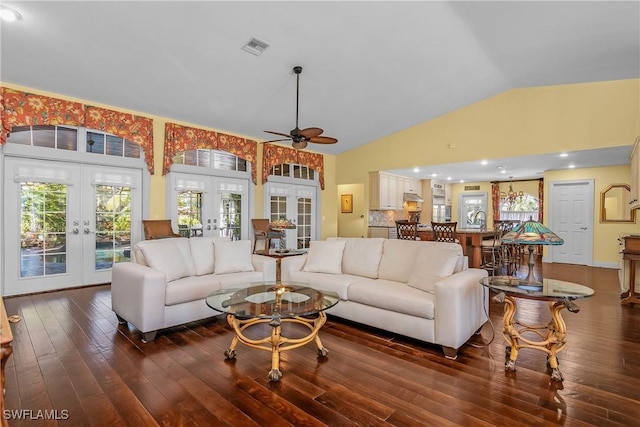 living room featuring ceiling fan, french doors, sink, dark hardwood / wood-style floors, and vaulted ceiling