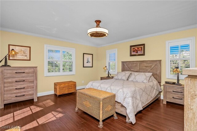 bedroom with multiple windows, crown molding, and dark hardwood / wood-style flooring