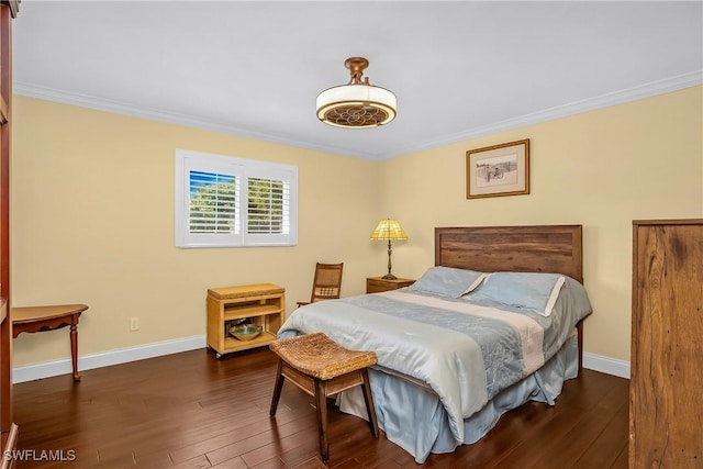 bedroom featuring dark hardwood / wood-style flooring and crown molding