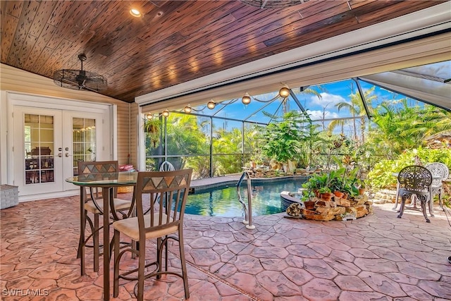 view of patio / terrace featuring french doors and glass enclosure