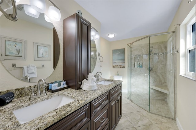 bathroom featuring vanity and an enclosed shower