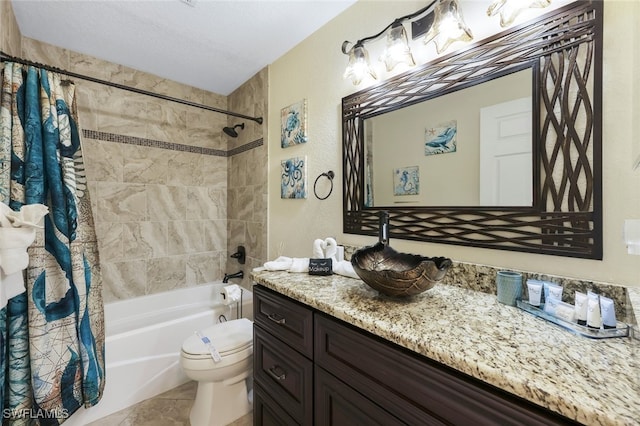 full bathroom with tile patterned flooring, a textured ceiling, toilet, shower / bath combo with shower curtain, and vanity