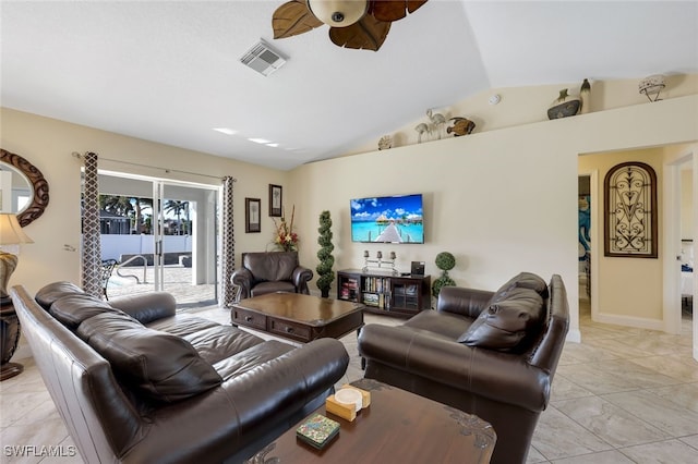 living room featuring ceiling fan and lofted ceiling