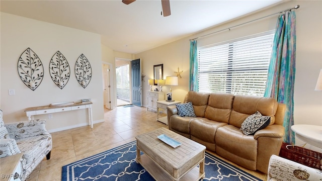 tiled living room with ceiling fan