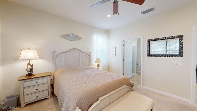 bedroom featuring ceiling fan and light carpet