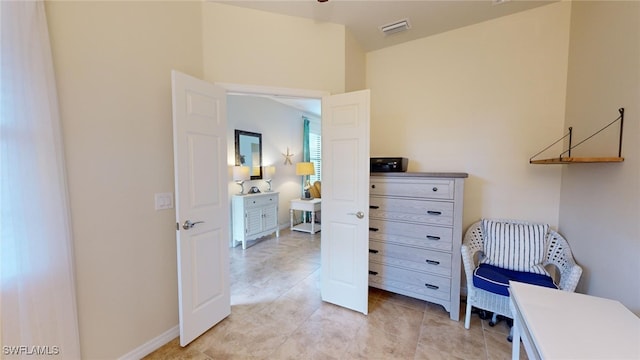 home office with light tile patterned floors