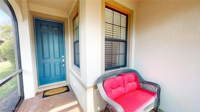 property entrance featuring stucco siding